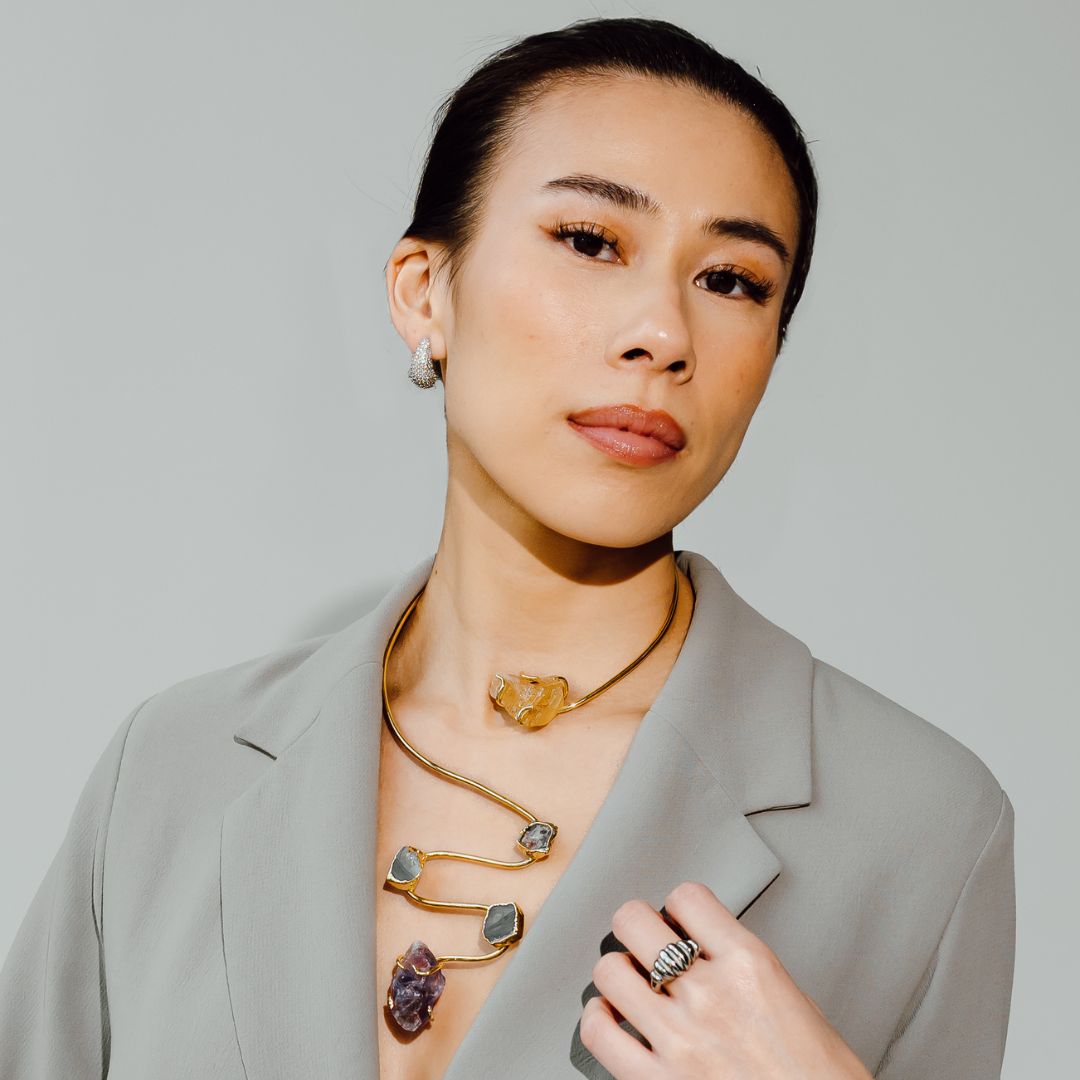 Model wearing the Siena handmade gold plated choker necklace with raw gemstone pendants