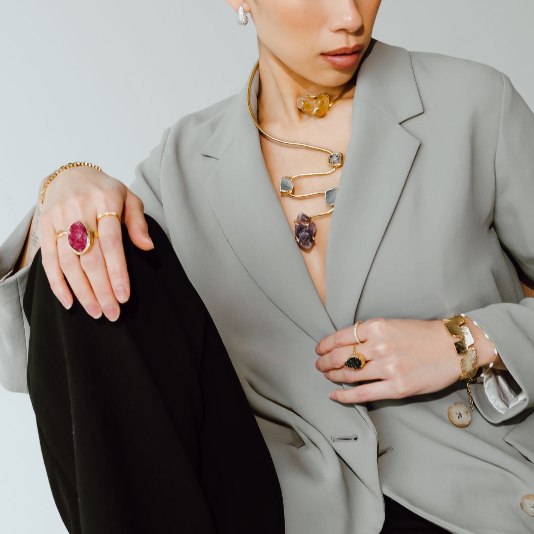 Model wearing the Siena handmade gold plated choker necklace with raw gemstone pendants