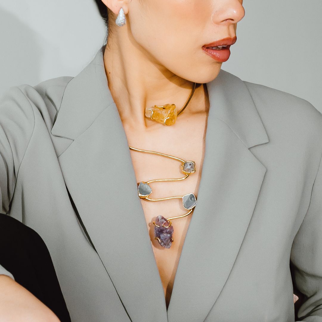 Model wearing the Siena handmade gold plated choker necklace with raw gemstone pendants