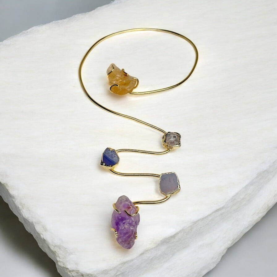 Siena handmade gold plated choker necklace with raw amethyst, agate and citrine stones on a stone slab